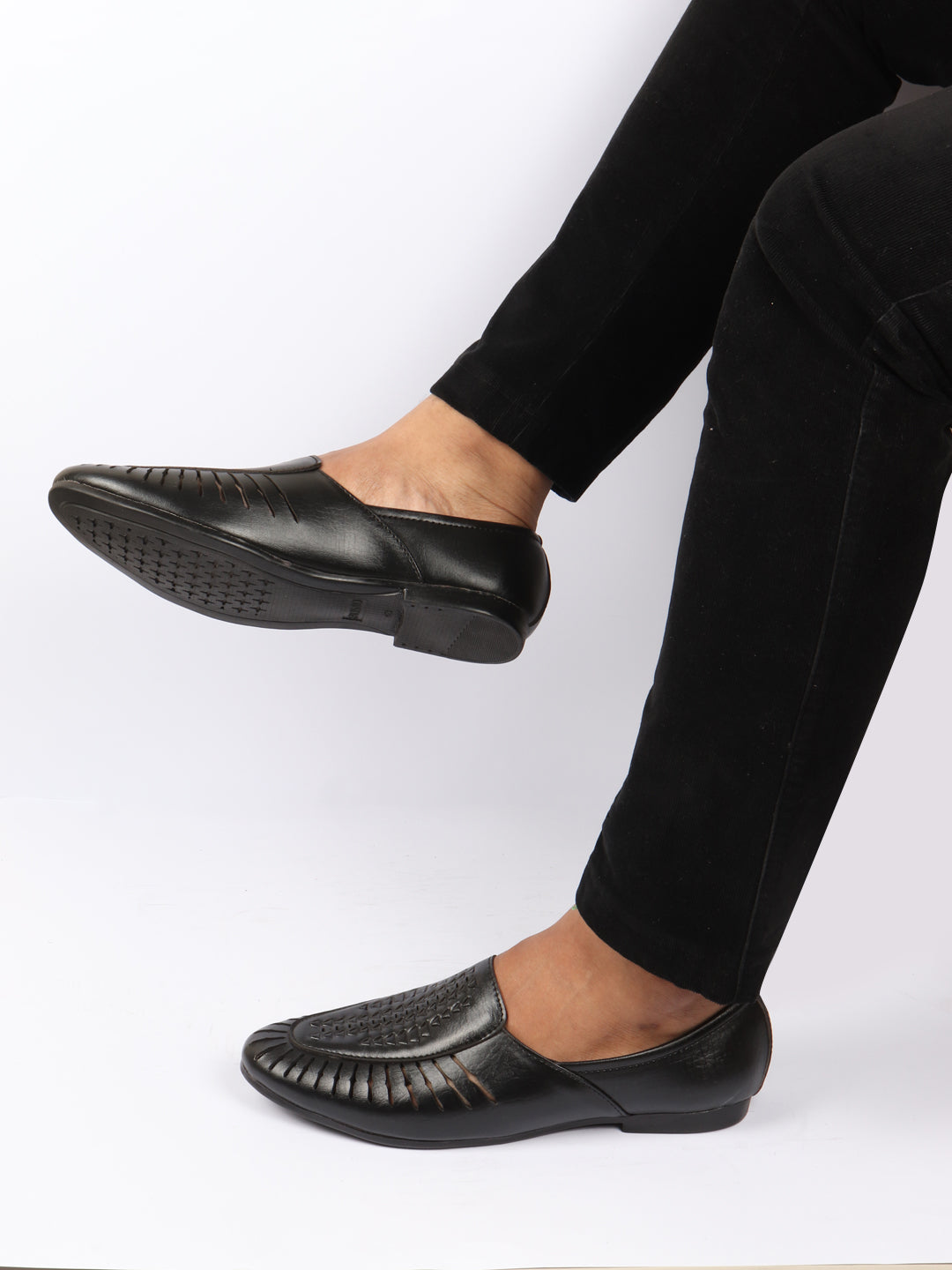 shop men black laser cut design ethnic slip on party juttis and mojaris online.