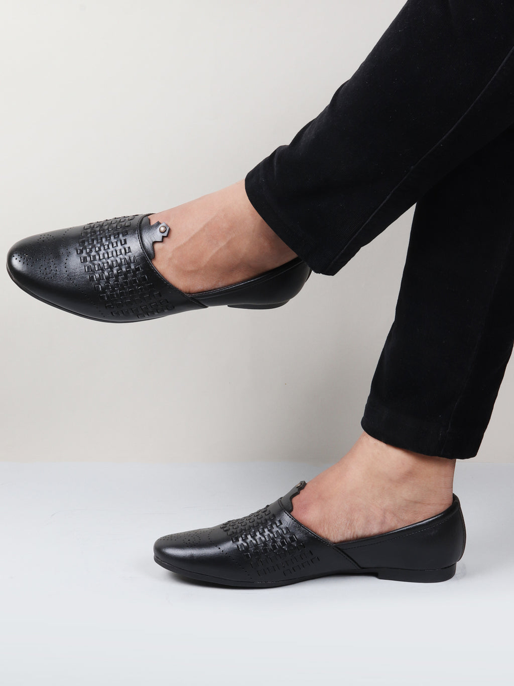 Shop Men Black Laser Cut Knitted Design Ethnic Wedding Broad Feet Slip On Juttis and Mojaris Online.