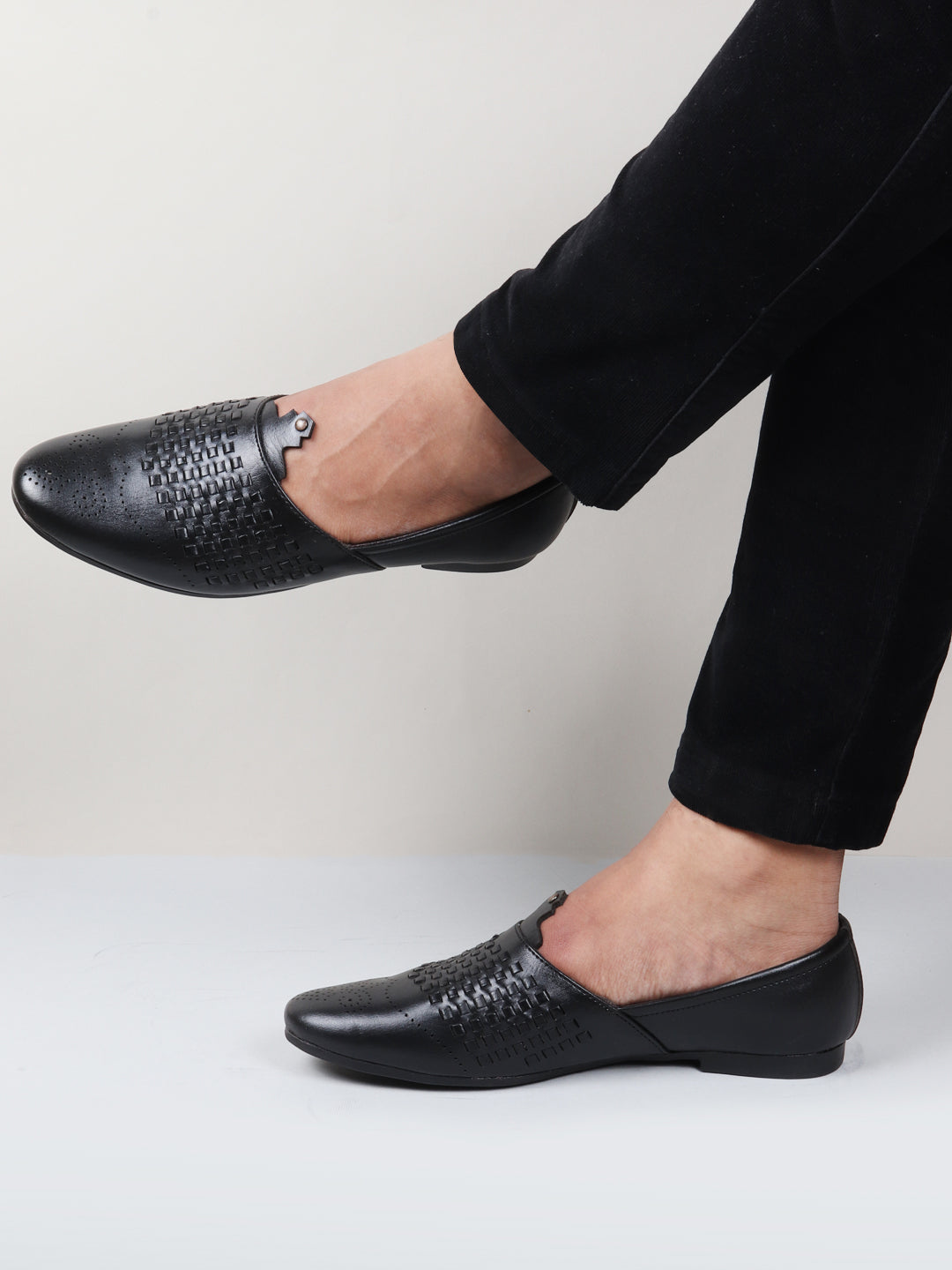 Shop Men Black Laser Cut Knitted Design Ethnic Wedding Broad Feet Slip On Juttis and Mojaris Online.