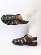 Shop Men Black Genuine Leather Multi Strap Closed Toe Roman Sandals Online.