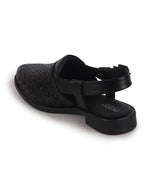 men slip on peshawari chappal