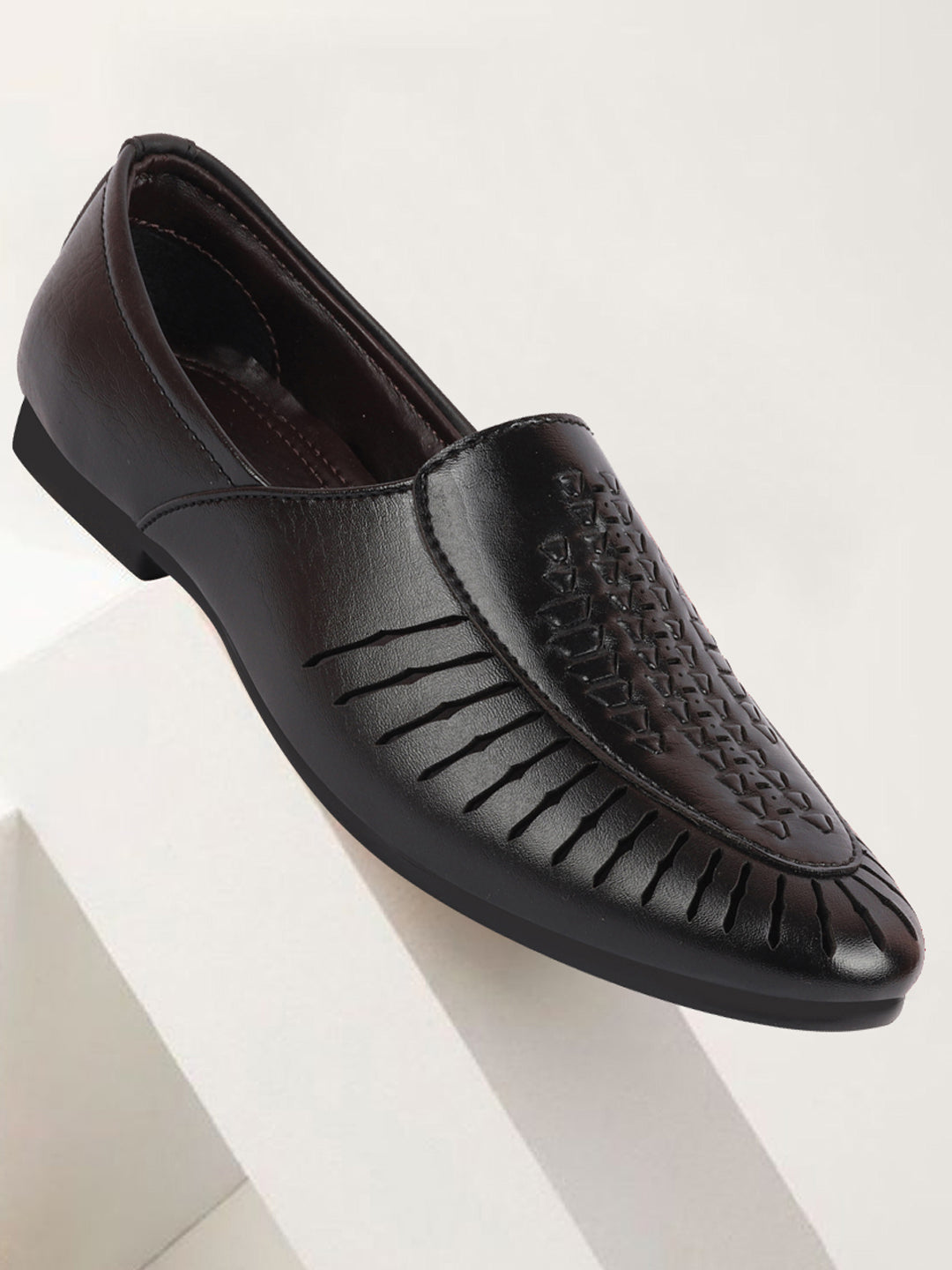 shop men black laser cut design ethnic slip on party juttis and mojaris online.