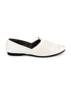 Shop Men White Laser Cut Knitted Design Ethnic Wedding Broad Feet Slip On Juttis and Mojaris Online.