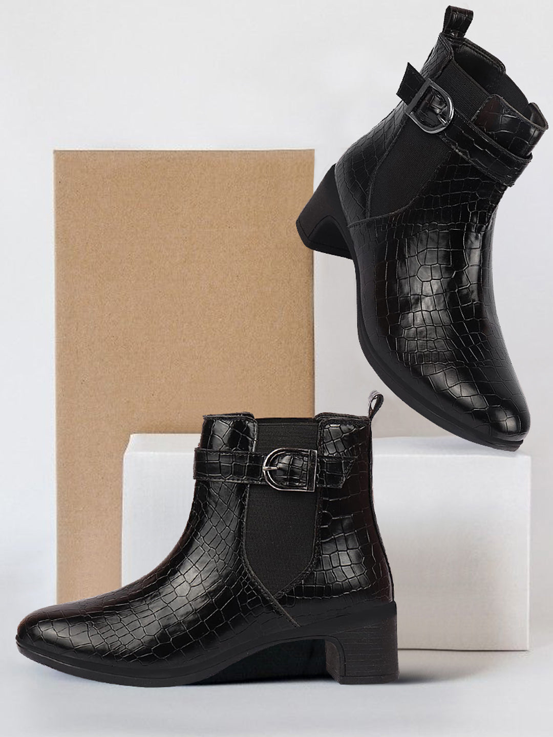 Shop Women Black Flared Heel High Ankle Leopard Print Embossed Design Winter Buckle Strap Chelsea Boots Online.