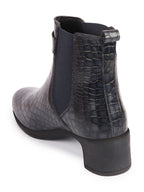Shop Women Navy Blue Flared Heel High Ankle Leopard Print Embossed Design Winter Buckle Strap Chelsea Boots Online.