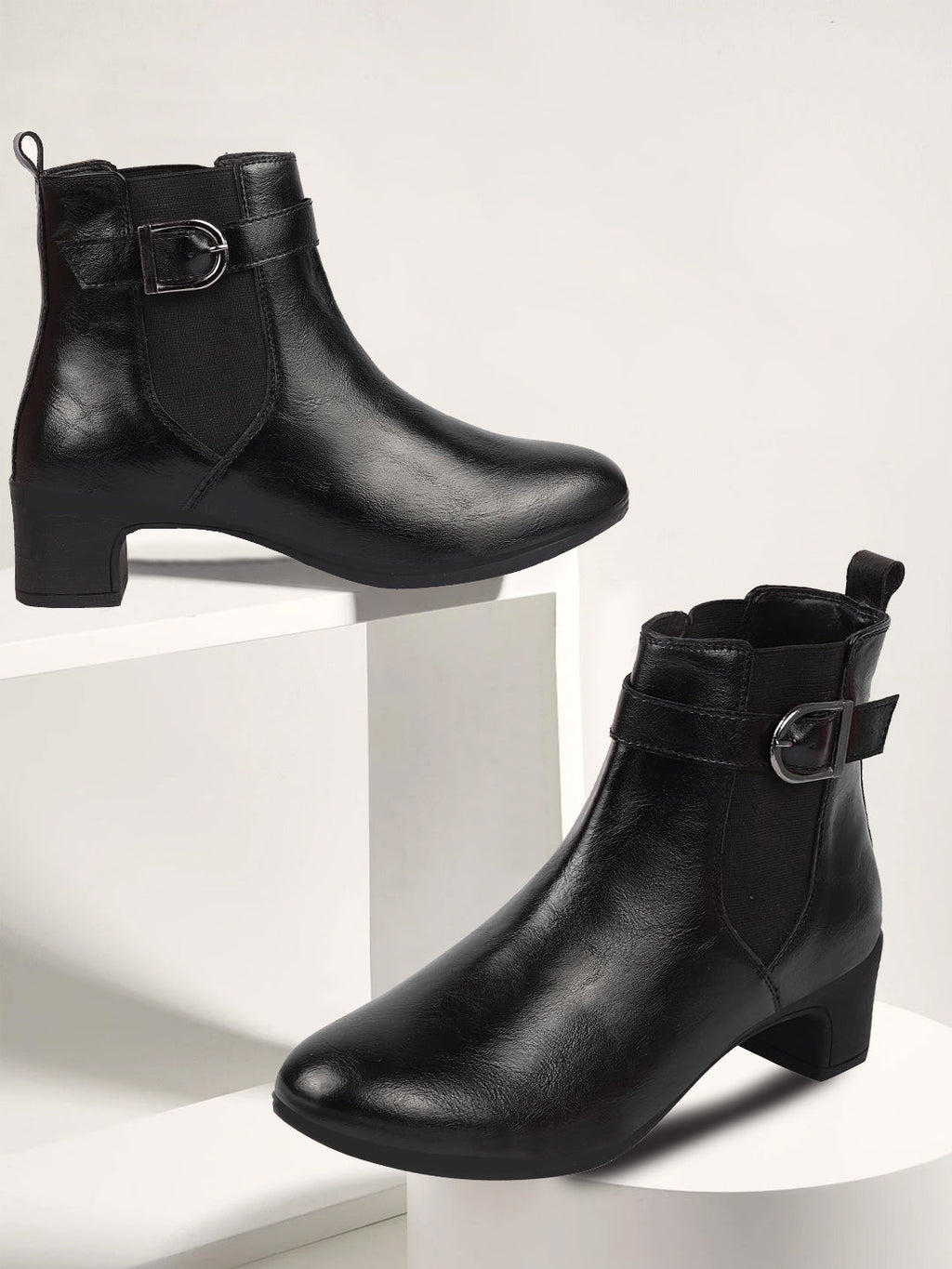 Shop Women Black Flared Heel High Ankle Classic Winter Buckle Strap Chelsea Boots Online.