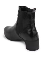 Shop Women Black Flared Heel High Ankle Classic Winter Buckle Strap Chelsea Boots Online.