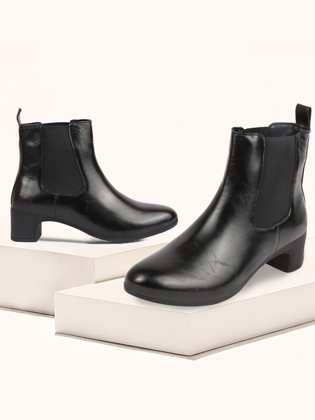 Shop Women Black Flared Heel High Ankle Top Winter Chelsea Boots Online.