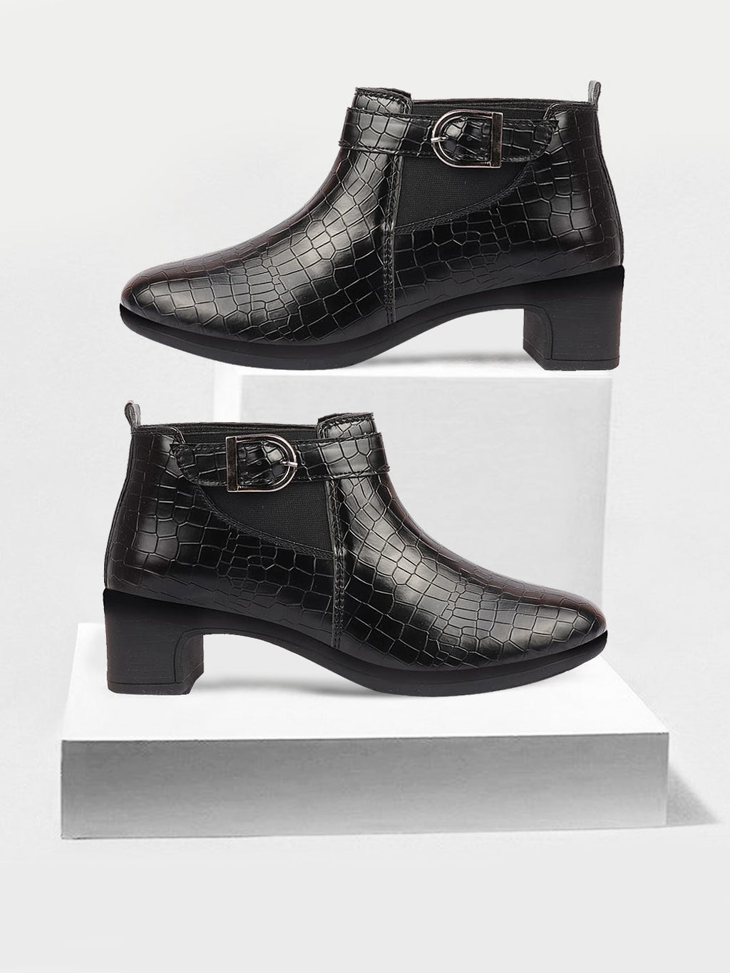 Shop Women Black Flared Heel Mid Top Leopard Print Embossed Design Buckle Strap Chelsea Boots Online.