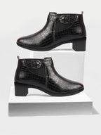 Shop Women Black Flared Heel Mid Top Leopard Print Embossed Design Buckle Strap Chelsea Boots Online.