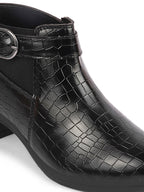 Shop Women Black Flared Heel Mid Top Leopard Print Embossed Design Buckle Strap Chelsea Boots Online.