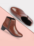Shop Women Tan Flared Heel Mid Top Leopard Print Embossed Design Side Zipper Classic Boots Online.
